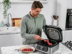 Ninja Grill und Heißluftfritteuse AG301EU Foodi Grau-Schwarz< Haushaltsgeräte